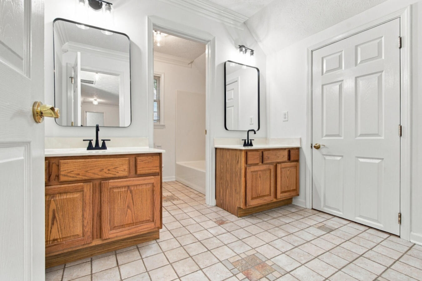 Bathroom with two vanities and matte black fixtures